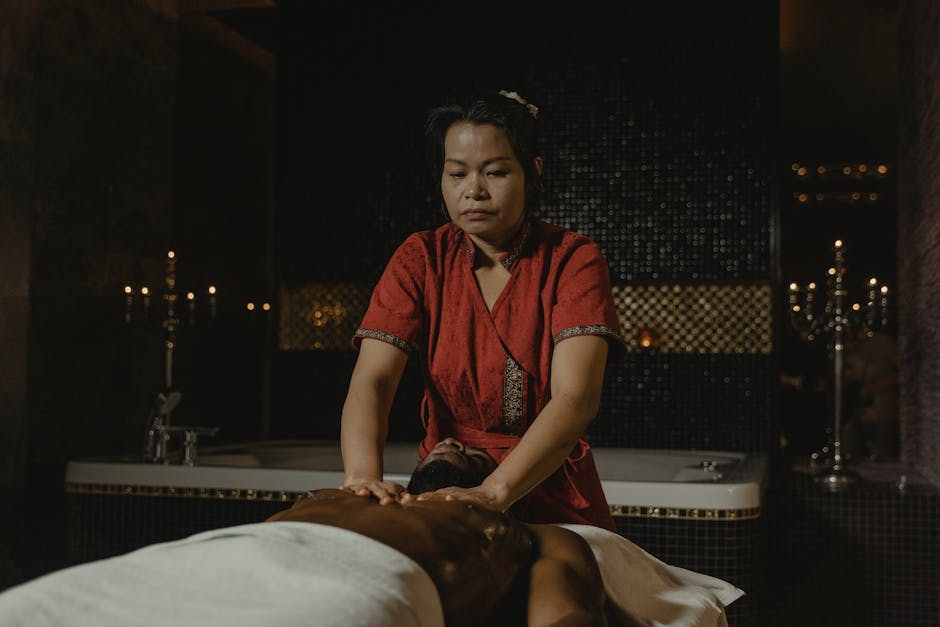 A skilled masseuse provides a relaxing massage in a tranquil spa setting