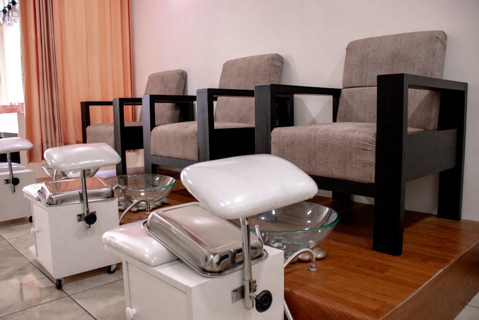 Cozy pedicure chairs and foot baths in a modern salon